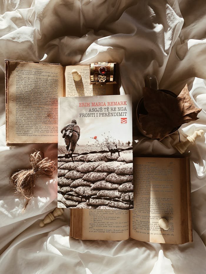 Warm autumn setting featuring books, coffee, and leaves, ideal for a cozy reading atmosphere.