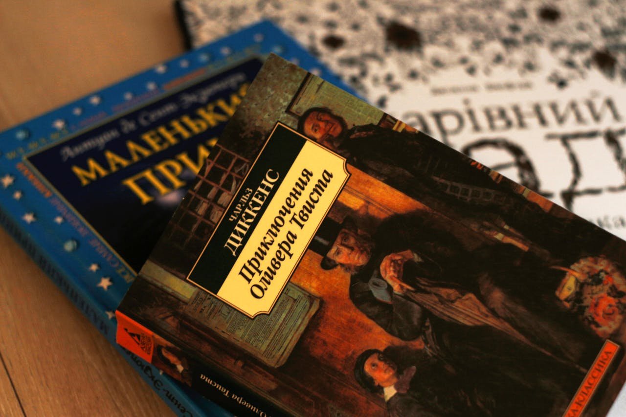 Close-up of Ukrainian versions of classic literature, including Oliver Twist by Charles Dickens.